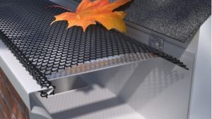 Gutter guards and screens to prevent debris buildup and enhance gutter efficiency